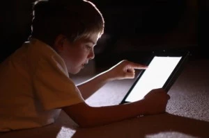 A kid on a tablet.